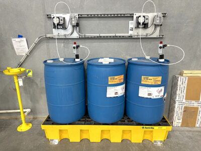 Waste treatment drum alarms on skid